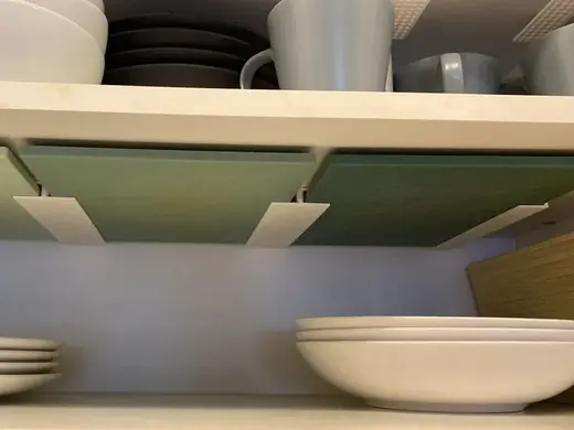 Cuttingboard holder under a shelf/cupboard
