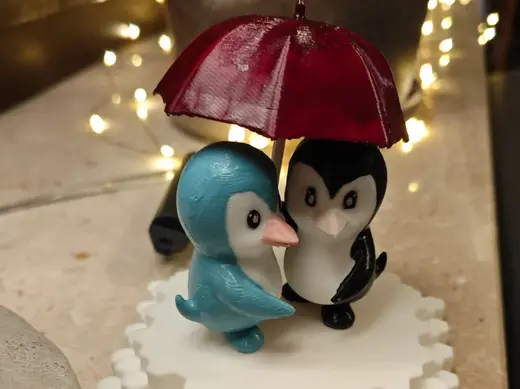 Pinguine mit Regenschirm