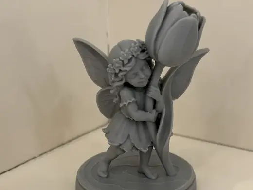 Garden Fairy Holding A Tulip