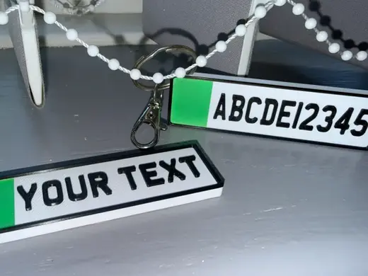 A keyring design replicating the UK number plates