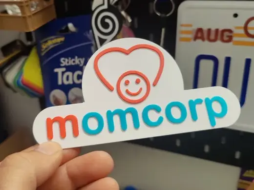 momcorp wall sign