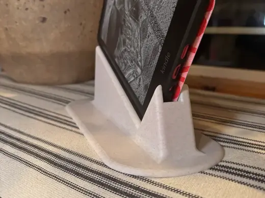 Titled kindle stand for laying in bed