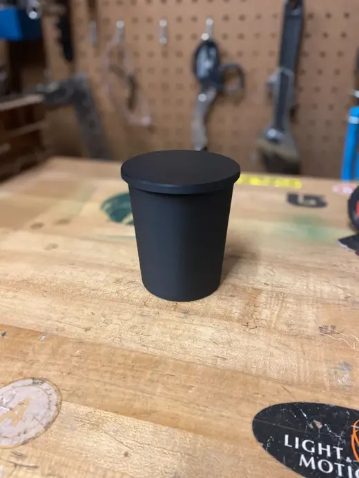 Cupholder trash can with flip top and snap