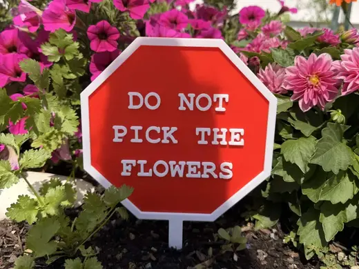 "Do not pick flowers" garden sign