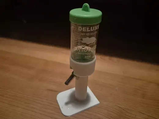 Standing hamster/gerbil water bottle support