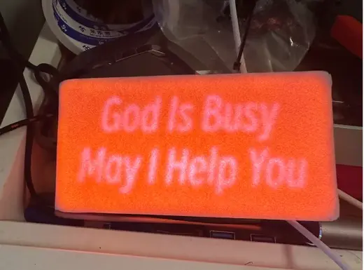 Lamp sign “God Is Busy May I Help Yow”