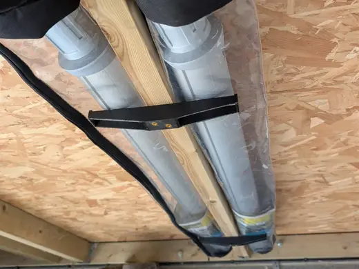 Ceiling joist shelf hanger for garage or store