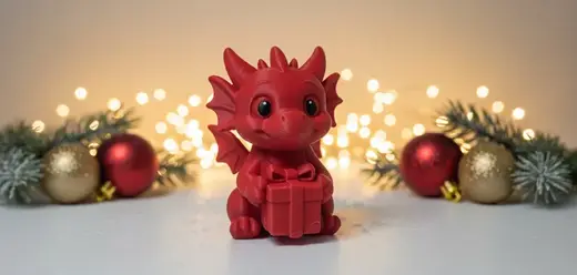 Baby Dragon Holding Gift Christmas Figurine
