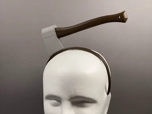 Axe through the head band (prop)