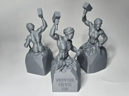"Never Give Up" motivational sculpture female vers