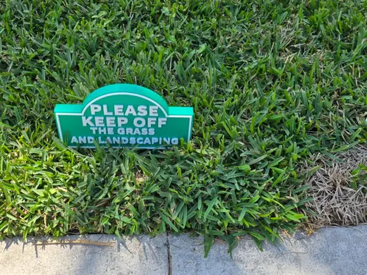 Keep off the grass and landscaping signs
