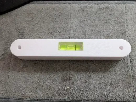 Drill helper with level to space pegboard (SKADIS)