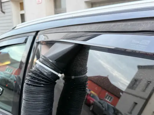 Diesel heater outlet to a car window