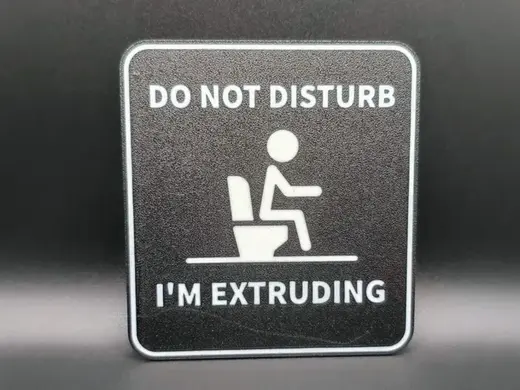 Bathroom sign "I'm extruding"