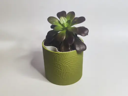 Self watering planter with floral pattern