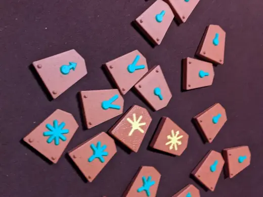 Shogi pieces and box, with relief Czech symbols