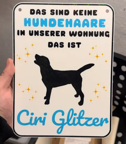 No dog hair but glitter sign