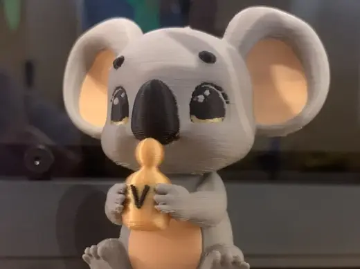 Koala holding perfume