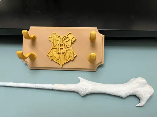 Wand wall mount with Hogwarts seal