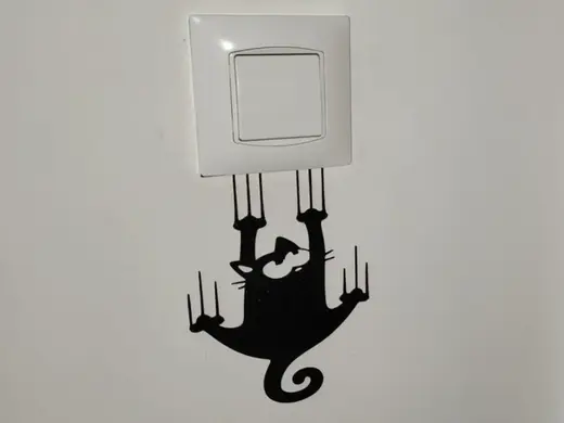 Hanging cat switch/socket art