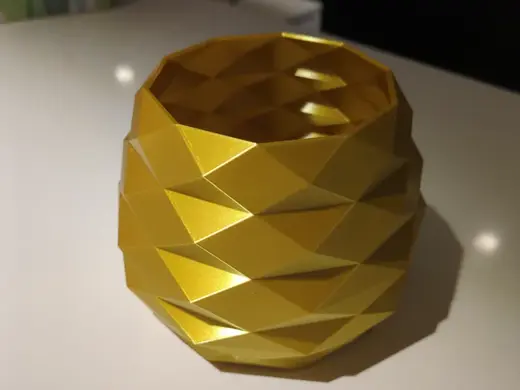 The low poly golden vase