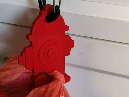 dog fire hydrant to carry full poop bags