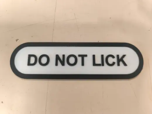 DO NOT LICK sign