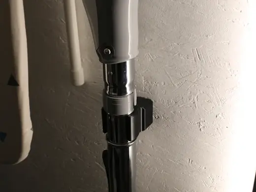 Wandhalter für eine Staubsauger-Düse