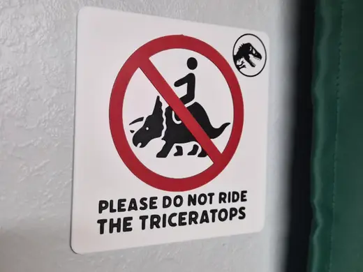 Do not ride the triceratops Jurassic sign