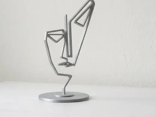 Escultura de Rostro Minimalista Line Art