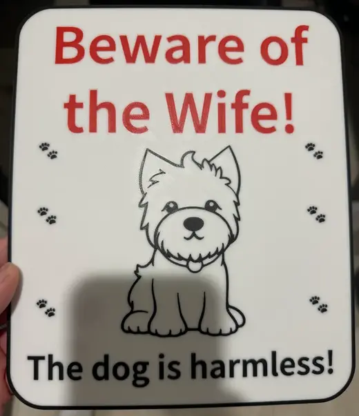 Beware of wife, dog is harmless