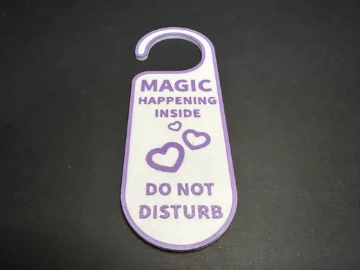 The Magic Happens inside door sign