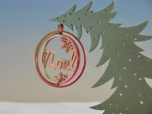 Christmas spinning ornament Noel