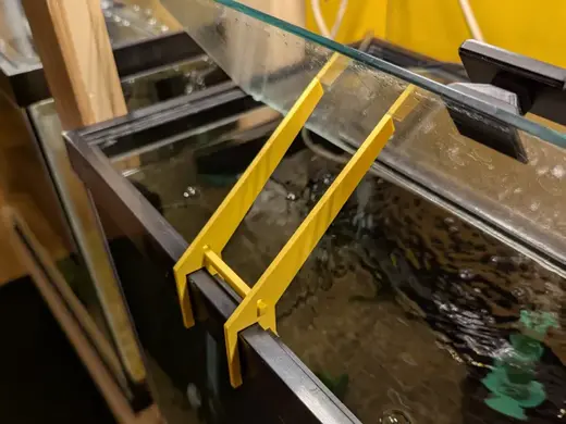 Framed aquarium top glass holder
