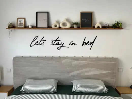 Wall lettering "let's stay in bed"
