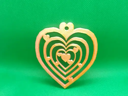 Heart-shaped bauble on the christmas tree