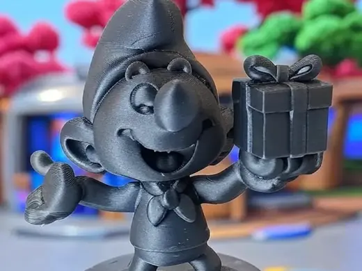 Schtroumpf cadeau avec présent et sourire