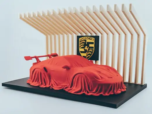 Porsche 911 GT3 RS covered on a diplay stand