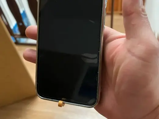 Hand-held phone holder for scrolling networks