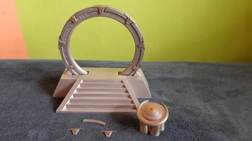 Stargate in an off-world pedestal with a DHD