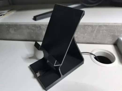 Mobile holder with charge cabel tunel