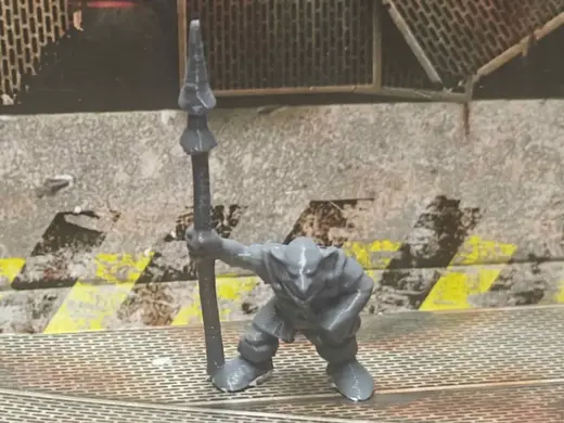Lil green Boy Holding Post with a Point