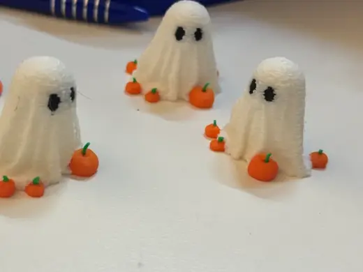 Mini Ghost for Halloween surrounded by pumpkins