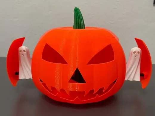 Halloween pumpkin with sliding ghosts