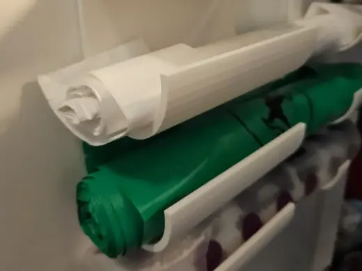 Trashbag holder for kitchen cabinet doors