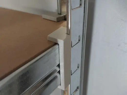 Clips and wall spacer for flimsy storage racks