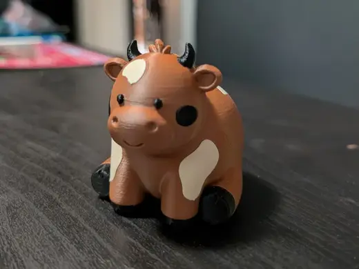 Cute Cow sitting down