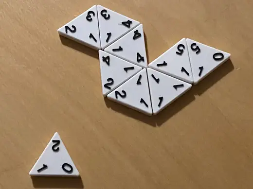Triominos: Dominoes Variant using Triangular Tiles