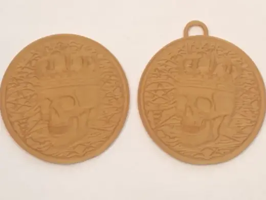 skull relief coin