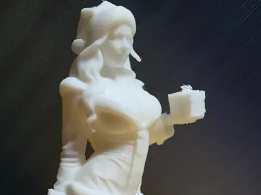 Woman in Christmas outfit holds a gift